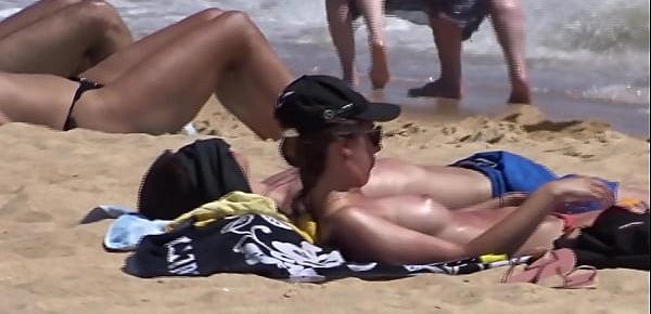  Woman with nice boobs at beach
